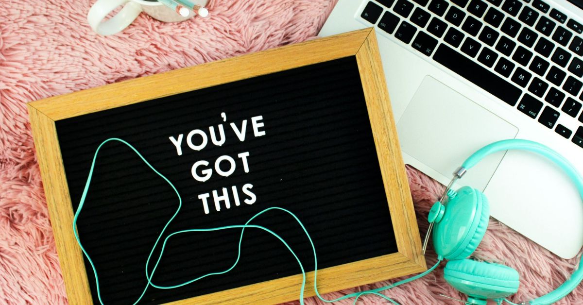 board that says" You've Got This", computer keyboard, headphones on a pink shag rug, How to support someone with ulcerative colitis