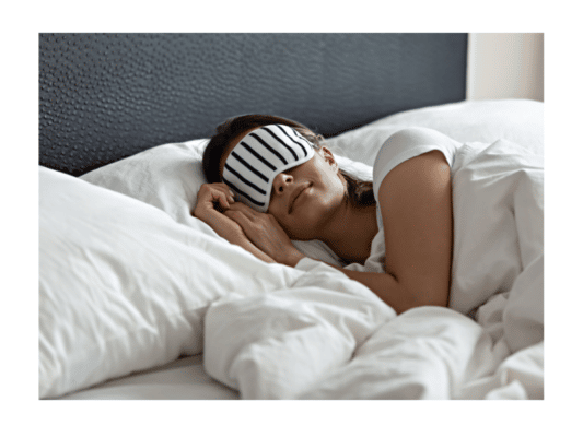 woman with IBD sleeping in bed with eye cover